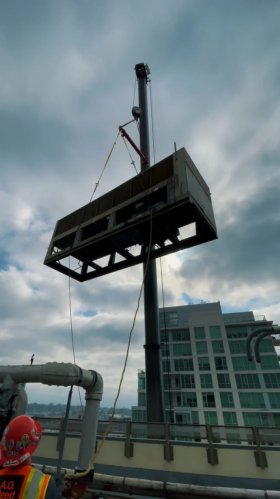 Video still of a crane lifting mechanical equipment at the Marriott Gaslamp project.