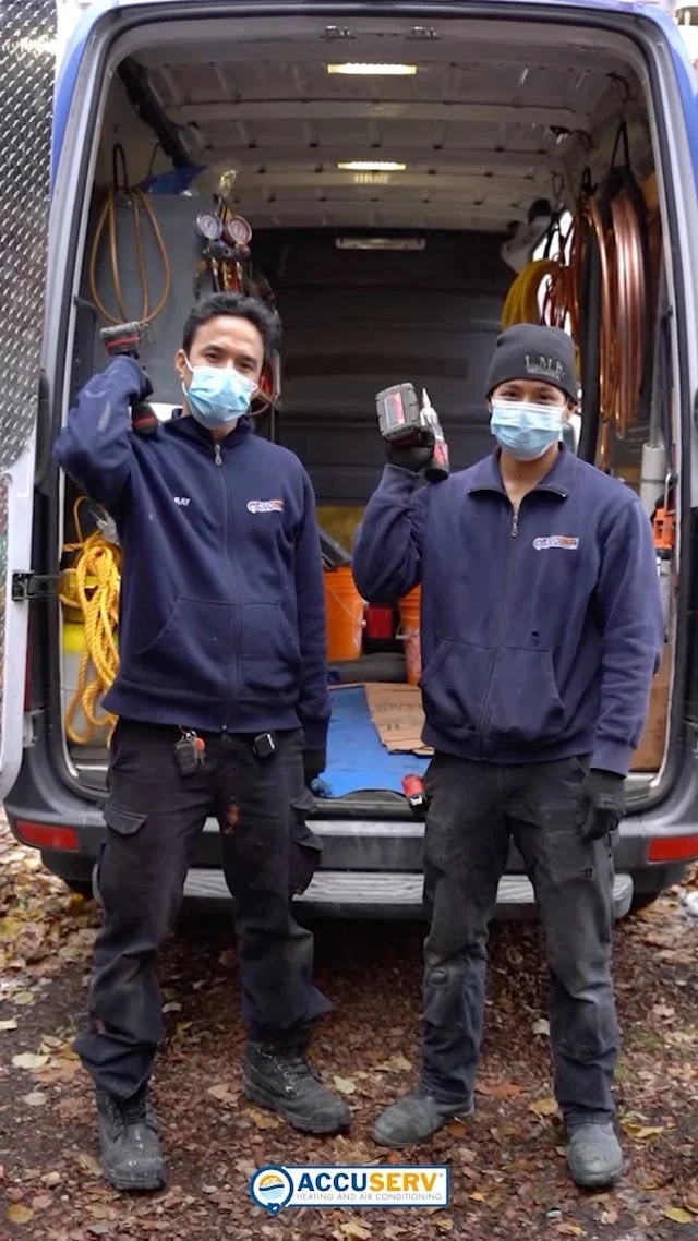 AccuServ technicians with tools, still from its emergency boiler-replacement video.
