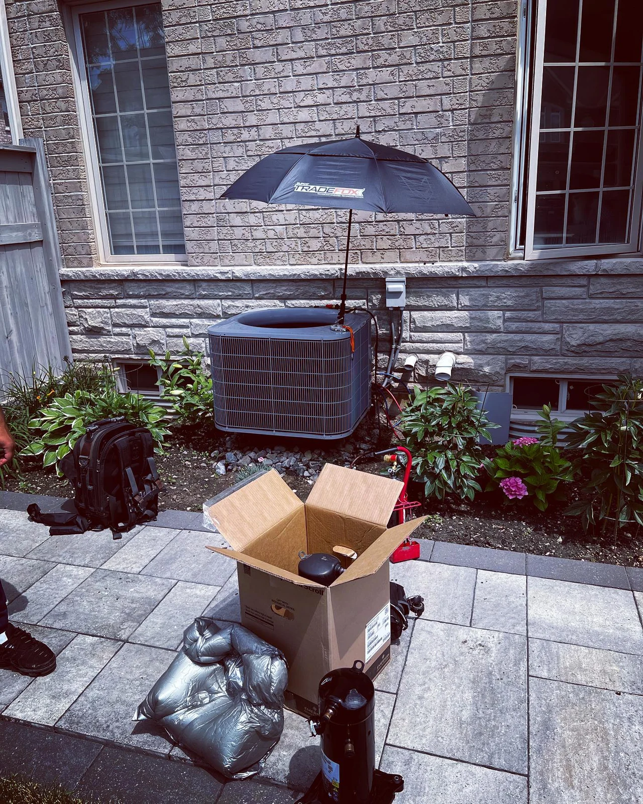 Air Makers outdoor service equipment at a residential property.