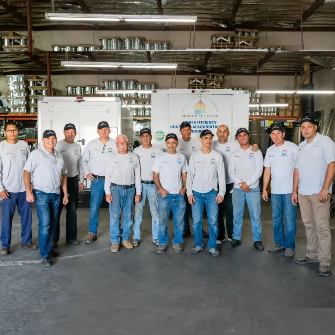 Around the Clock team assembled at the company workshop.