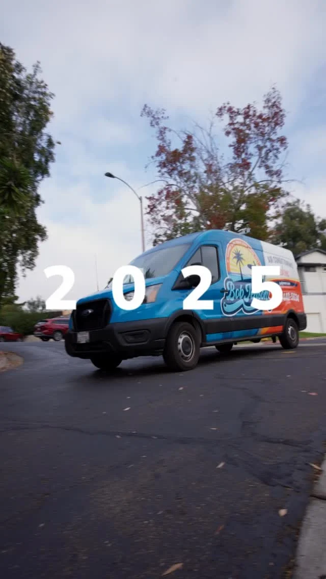 Video still of a Bob Jenson service van on the road.