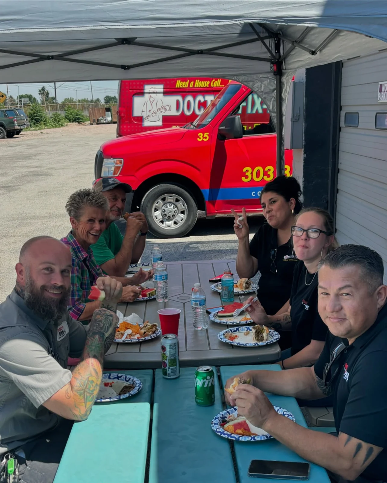 Doctor Fix-It staff at a company barbecue