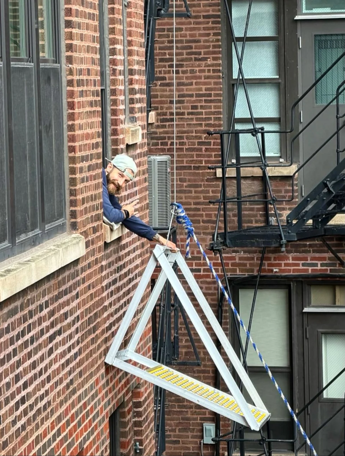 Five Star crew lifting HVAC equipment for a high-rise installation