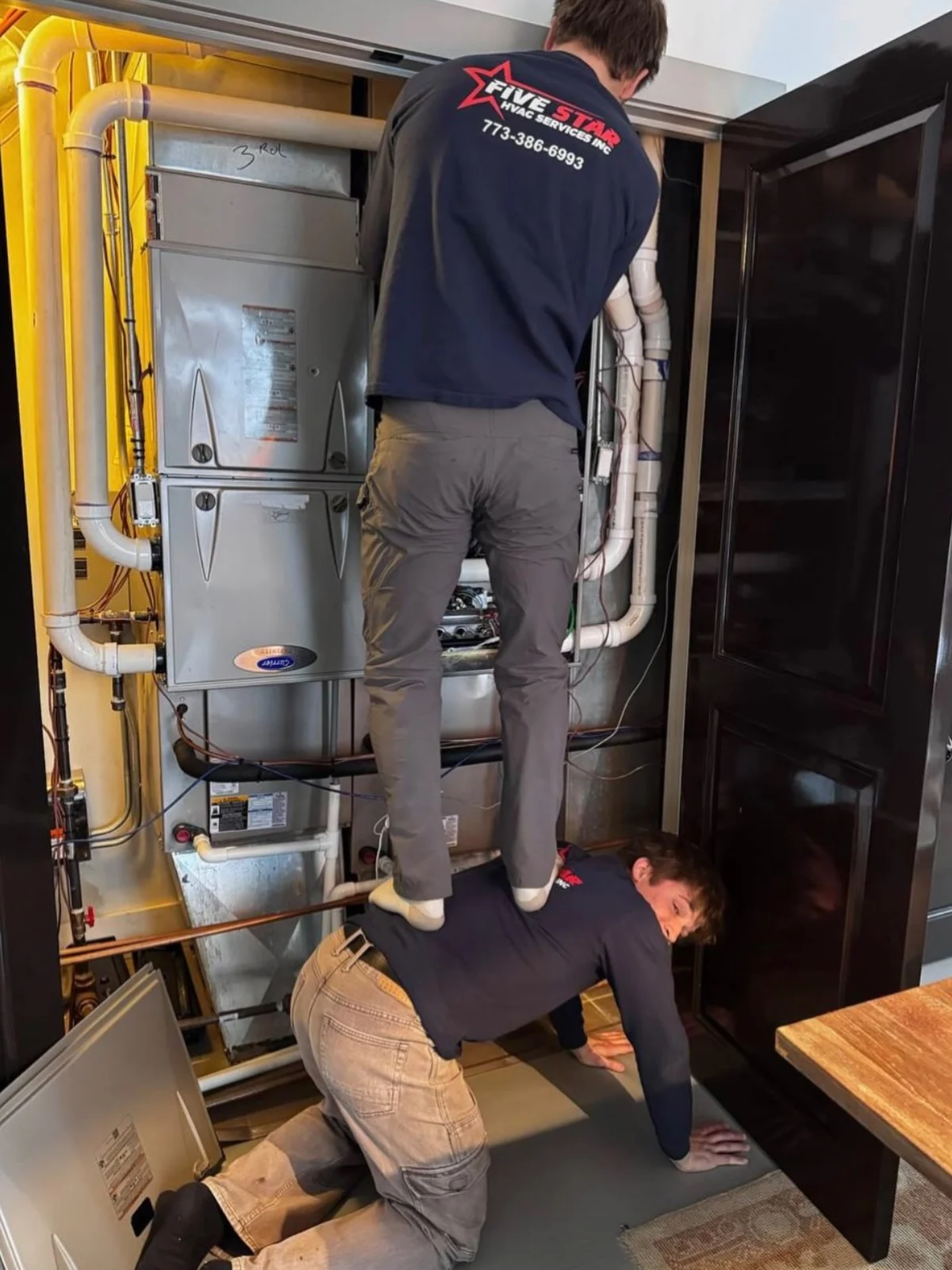Five Star technicians servicing an indoor HVAC system