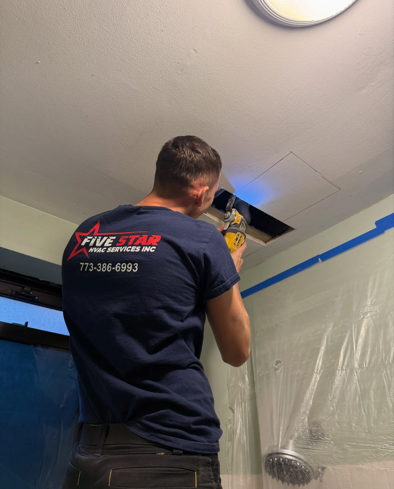 Five Star technician working on ceiling HVAC services
