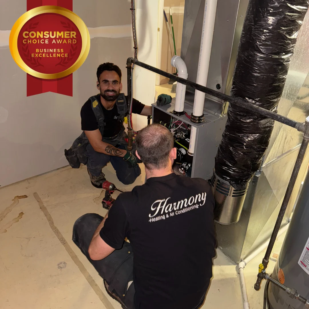 Harmony technicians working on a furnace installation