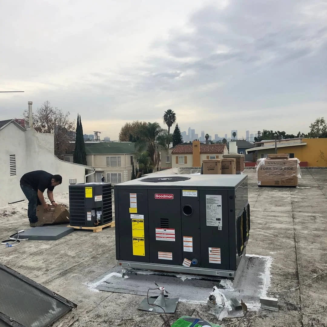Packaged HVAC units installed by Heating Alternatives on a duplex roof.