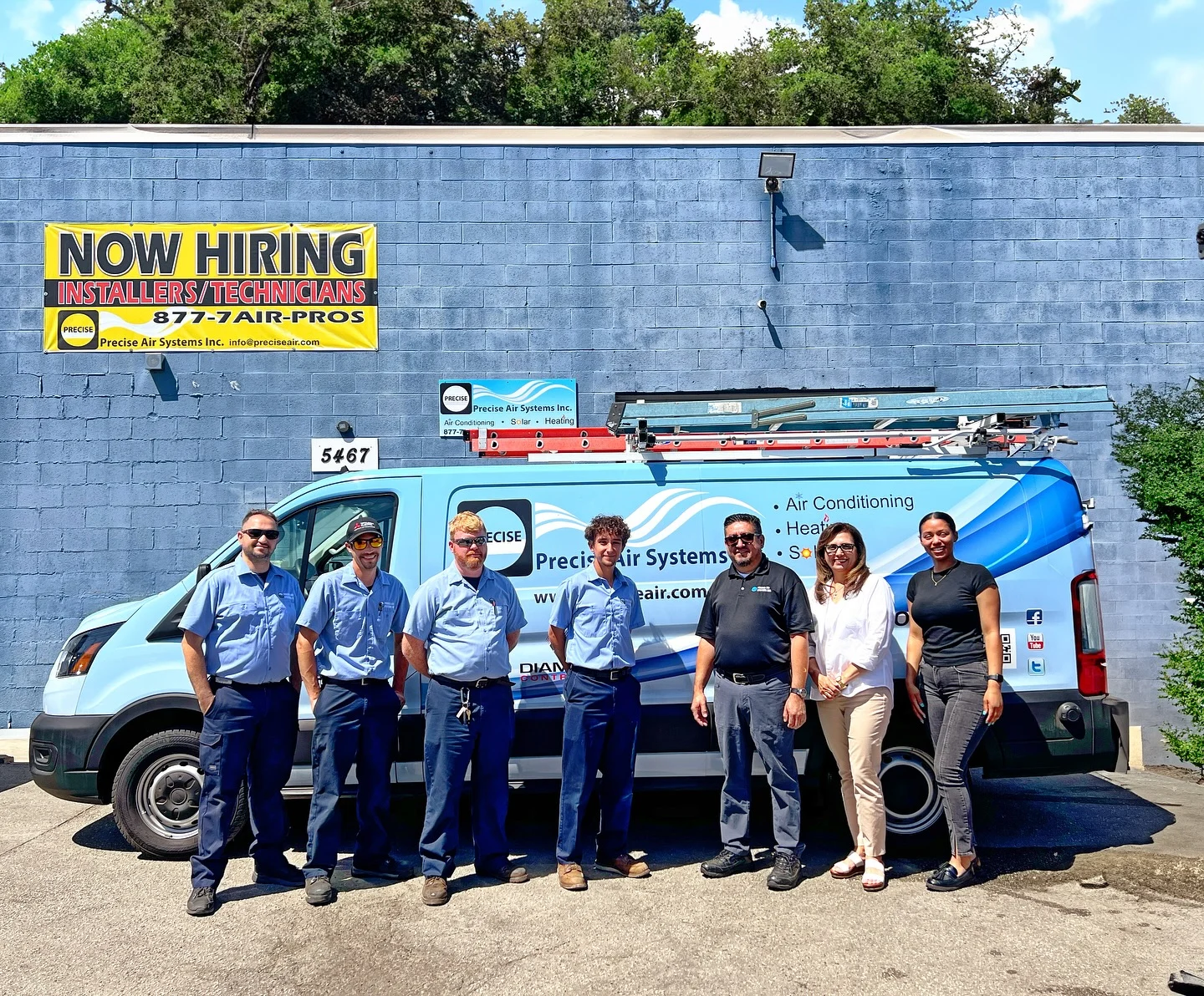 Precise Air Systems team beside their branded service van.